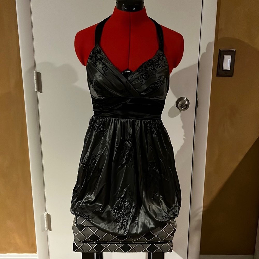 Gun metal gray and black backless dress with tie around neck. Size medium.